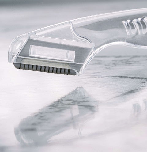 Eyebrow razor has micro-precision blades that are grooved for removing fine hairs around the eyebrows.